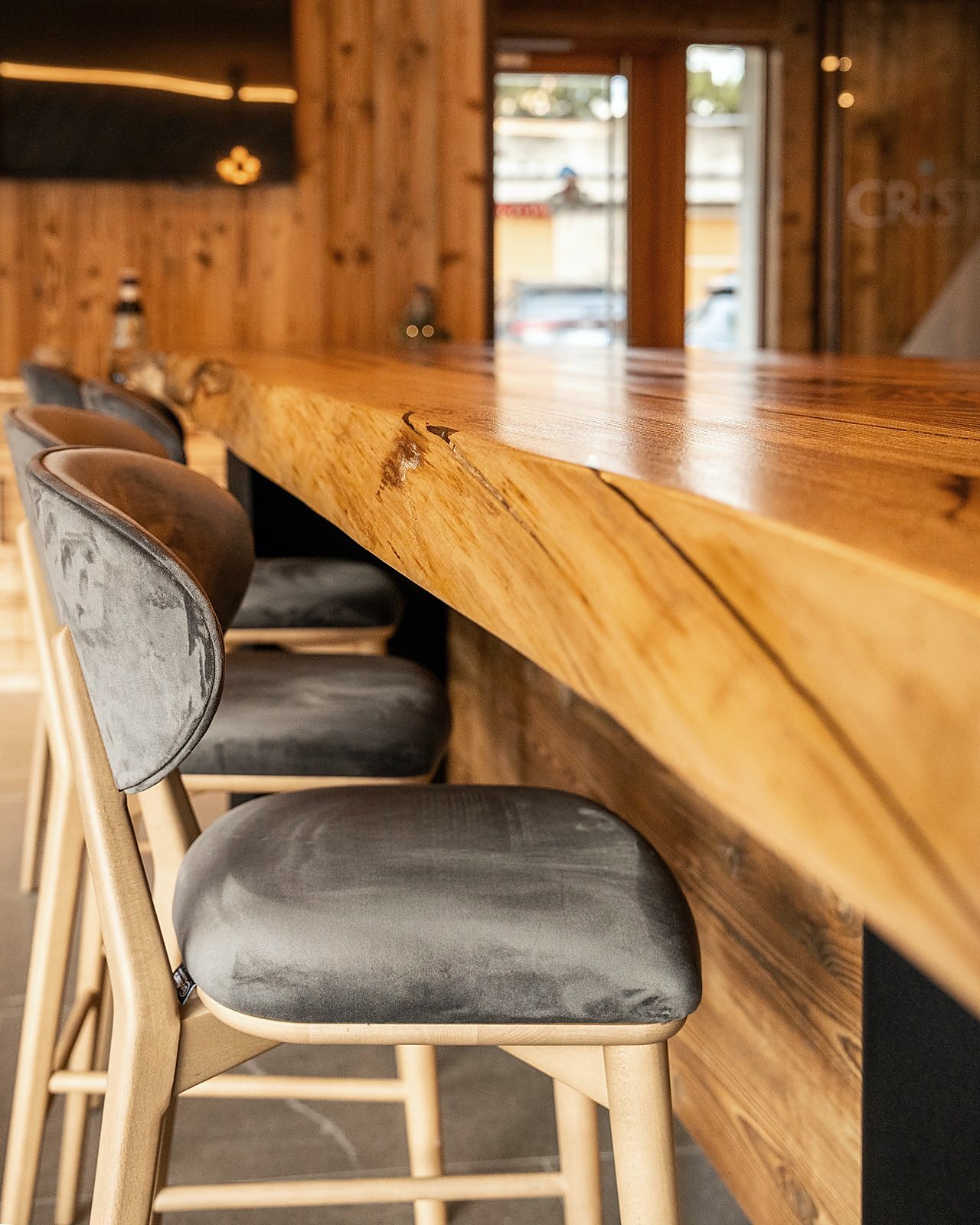 The end of the counter with high stools